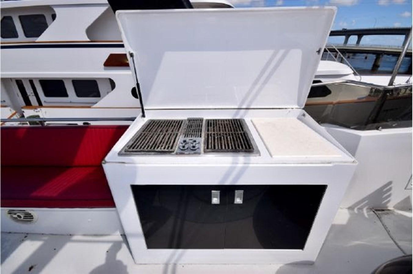 a white laptop on a boat aboard MAC LL Yacht for Sale