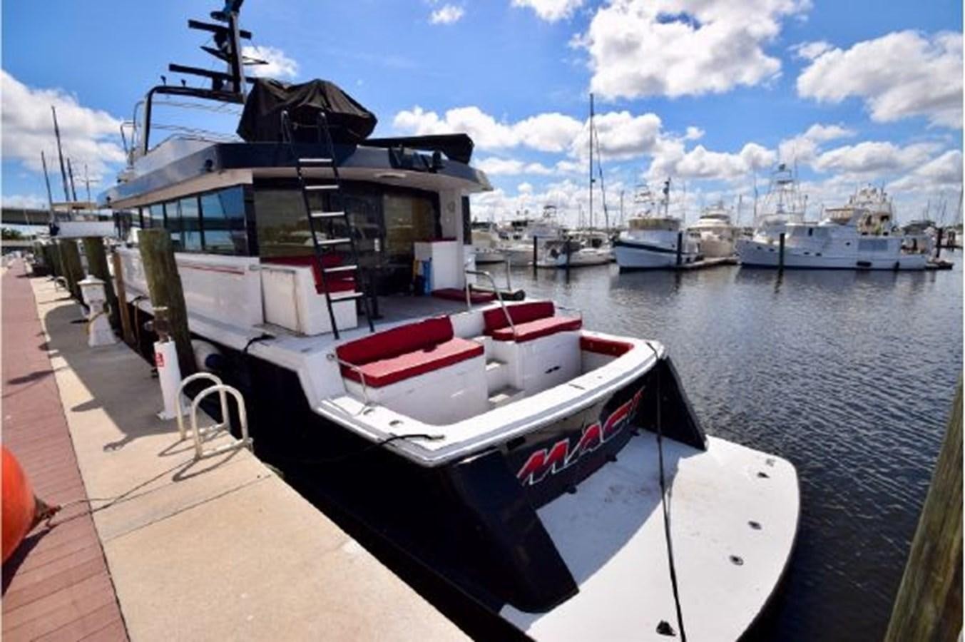 a boat docked at a pier aboard MAC LL Yacht for Sale