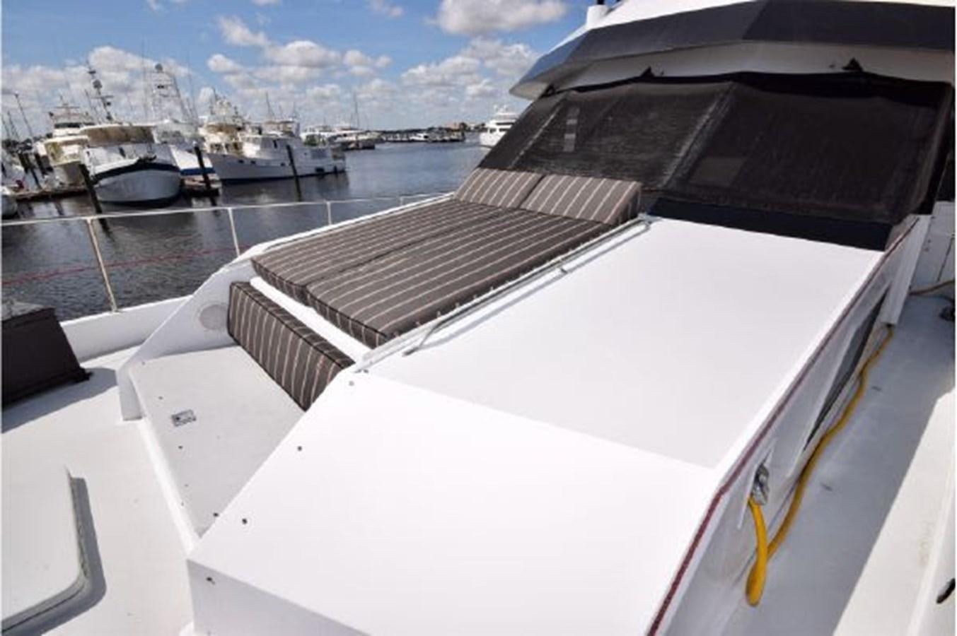 a boat with a deck and a deck with many boats on it aboard MAC LL Yacht for Sale