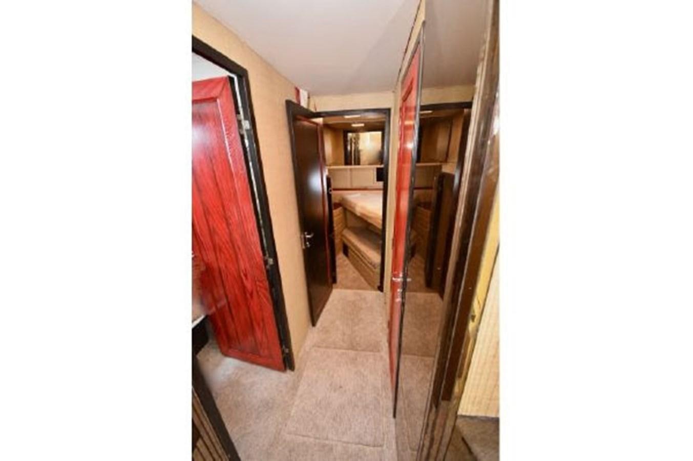 a hallway with a door and a staircase aboard MAC LL Yacht for Sale