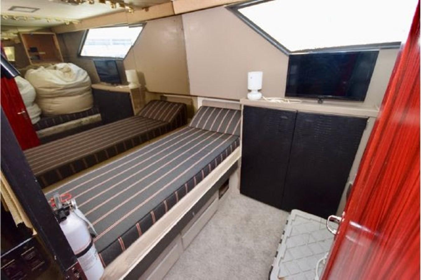 a room with a bed and a desk aboard MAC LL Yacht for Sale