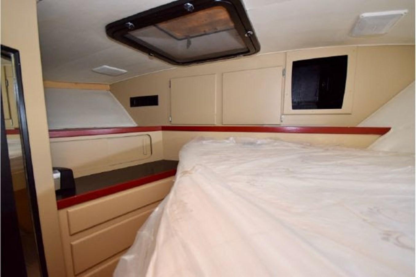 a bed in a room aboard MAC LL Yacht for Sale