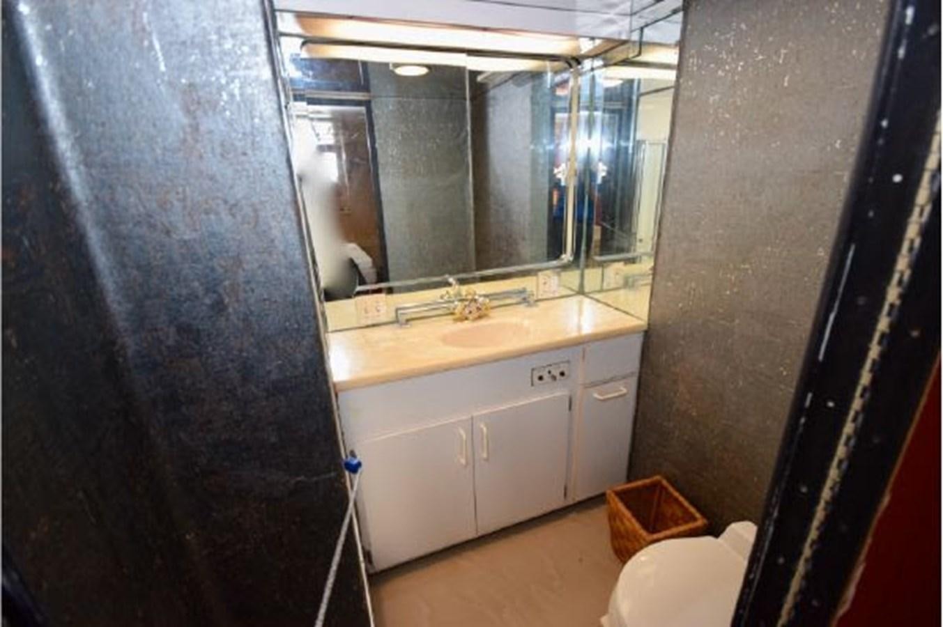 a bathroom with a large mirror aboard MAC LL Yacht for Sale