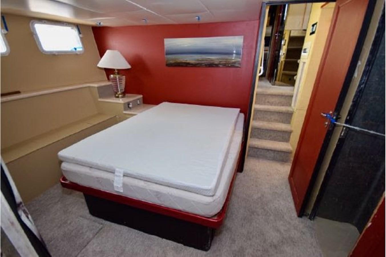 a bed in a room aboard MAC LL Yacht for Sale