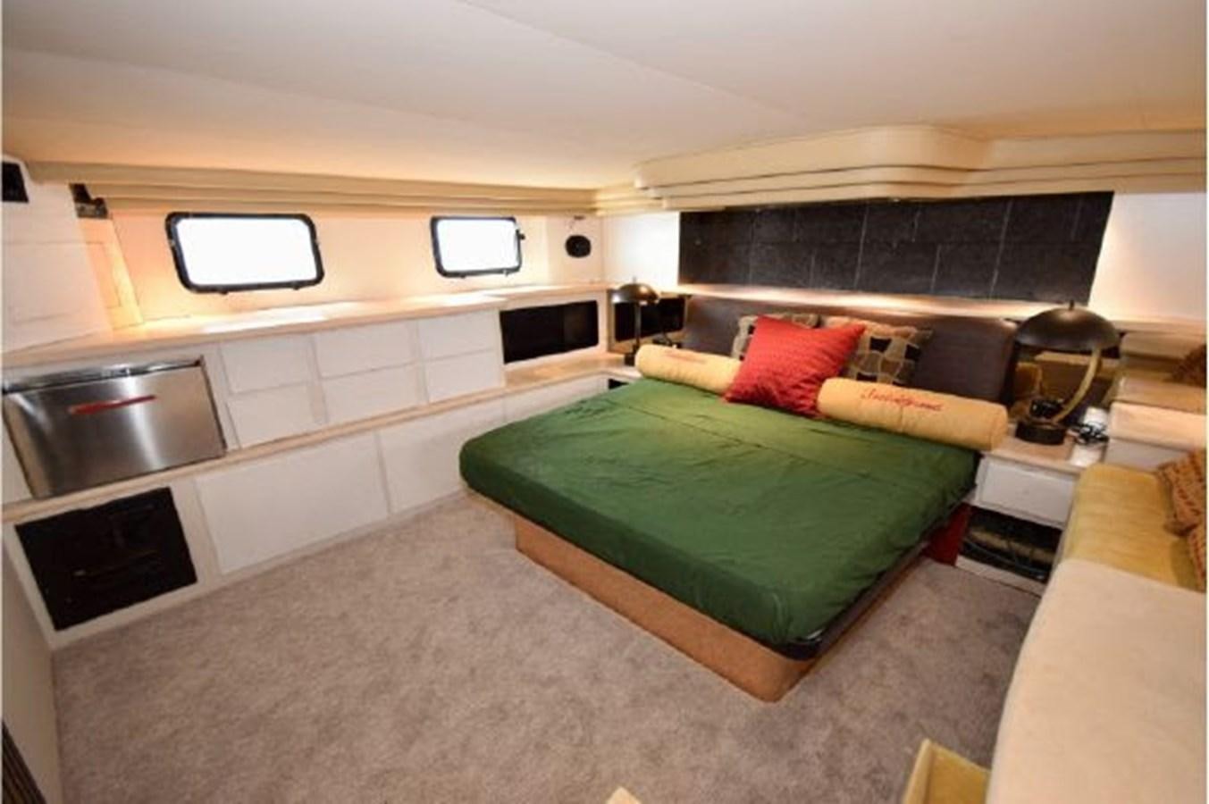 a bedroom with a bed and a sink aboard MAC LL Yacht for Sale
