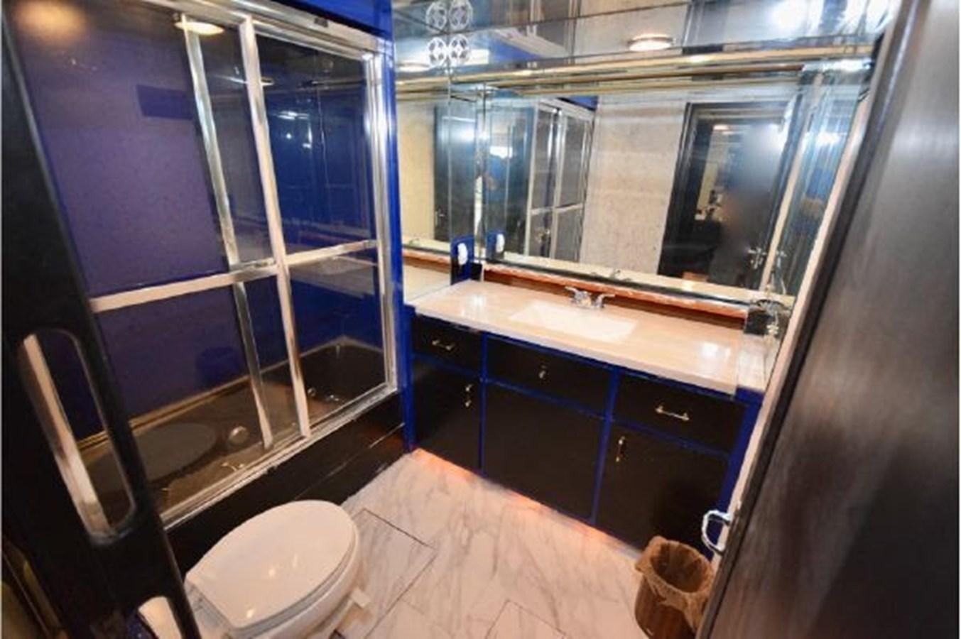 a bathroom with a large mirror aboard MAC LL Yacht for Sale