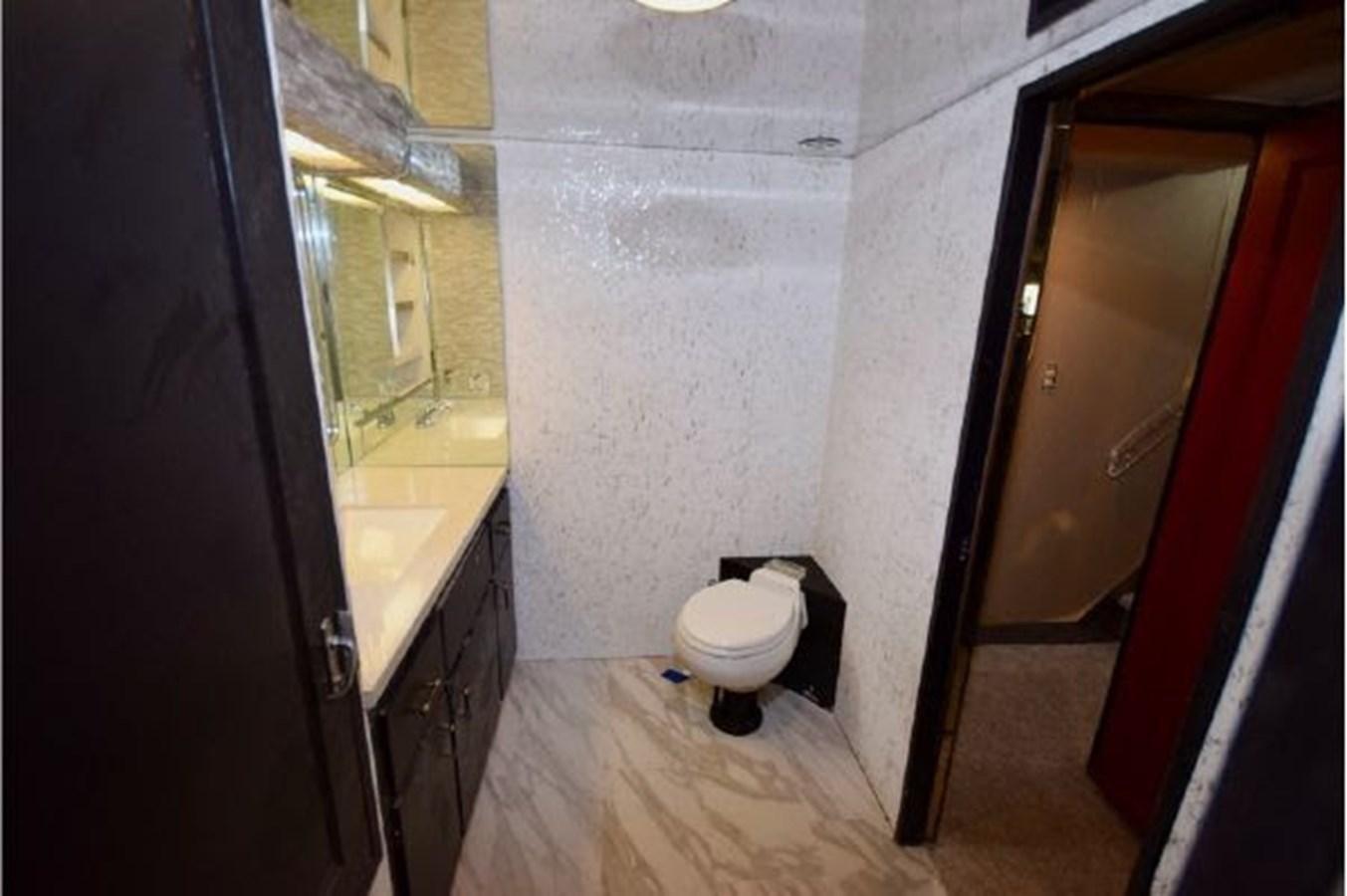 a bathroom with a toilet aboard MAC LL Yacht for Sale
