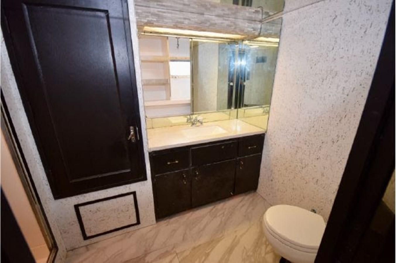 a bathroom with a black cabinet aboard MAC LL Yacht for Sale