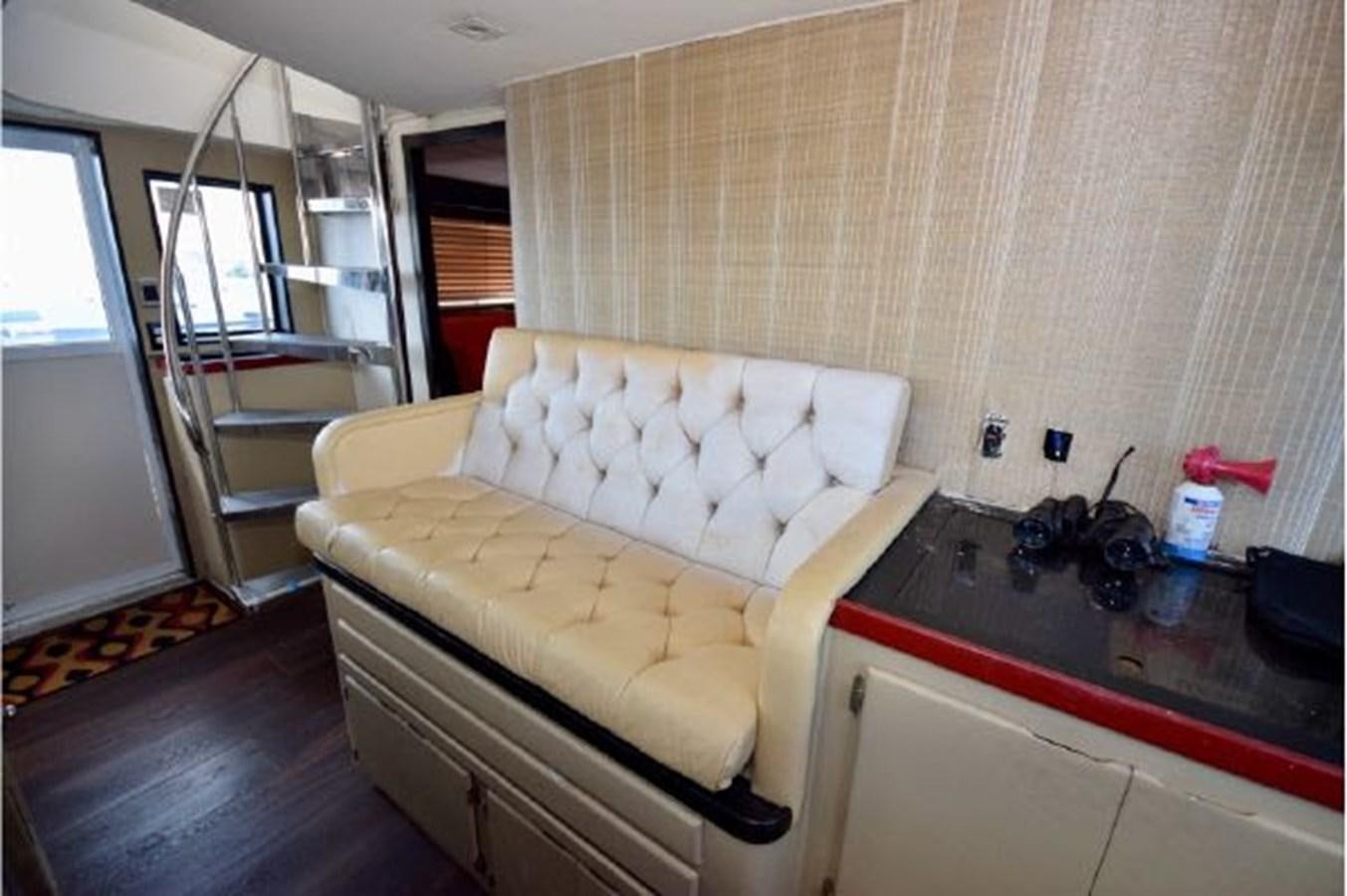 a living room with a couch aboard MAC LL Yacht for Sale