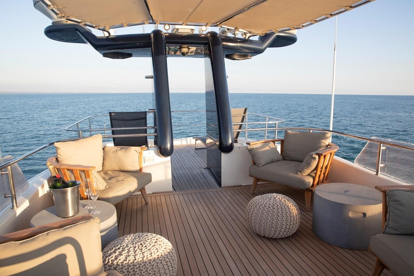 a deck with a view of the ocean and the ocean aboard BIM Yacht for Sale