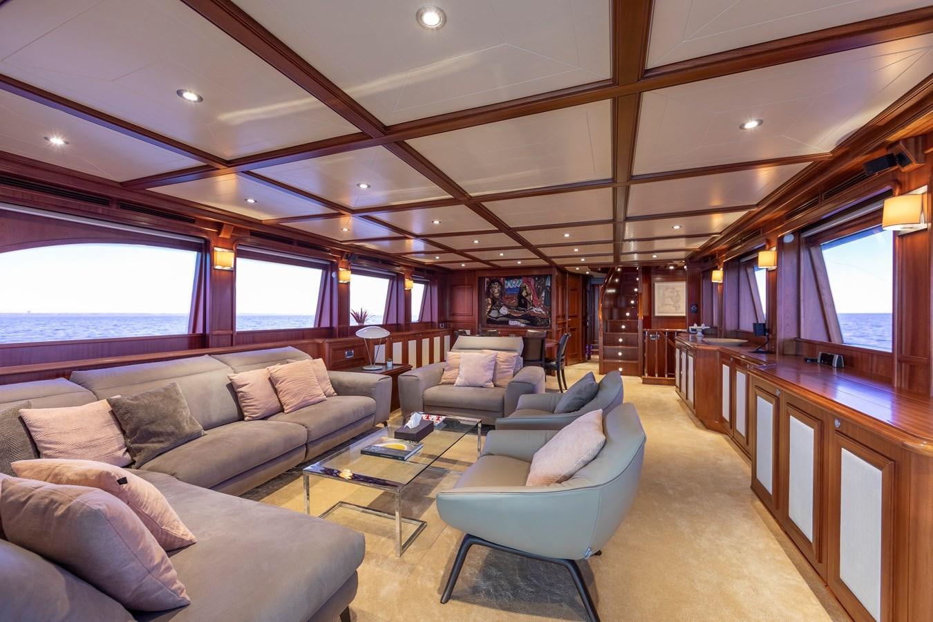 a living room with a large window aboard BIM Yacht for Sale