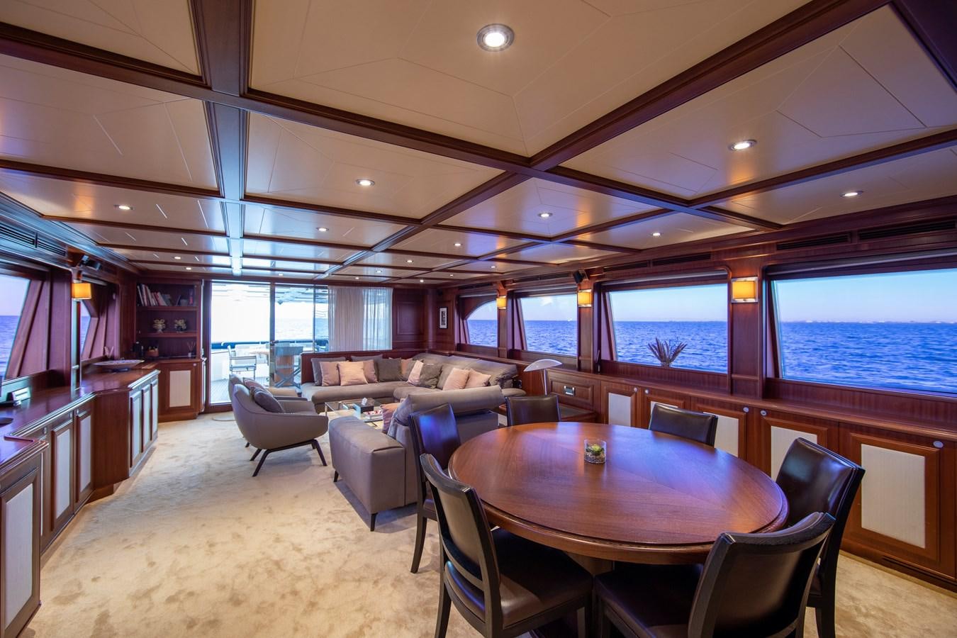 a large room with chairs and tables aboard BIM Yacht for Sale