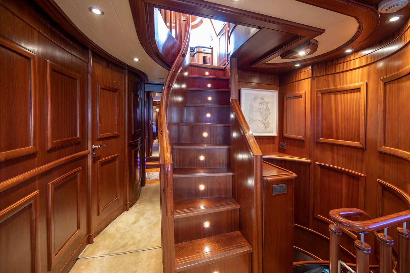 a wooden staircase in a room aboard BIM Yacht for Sale