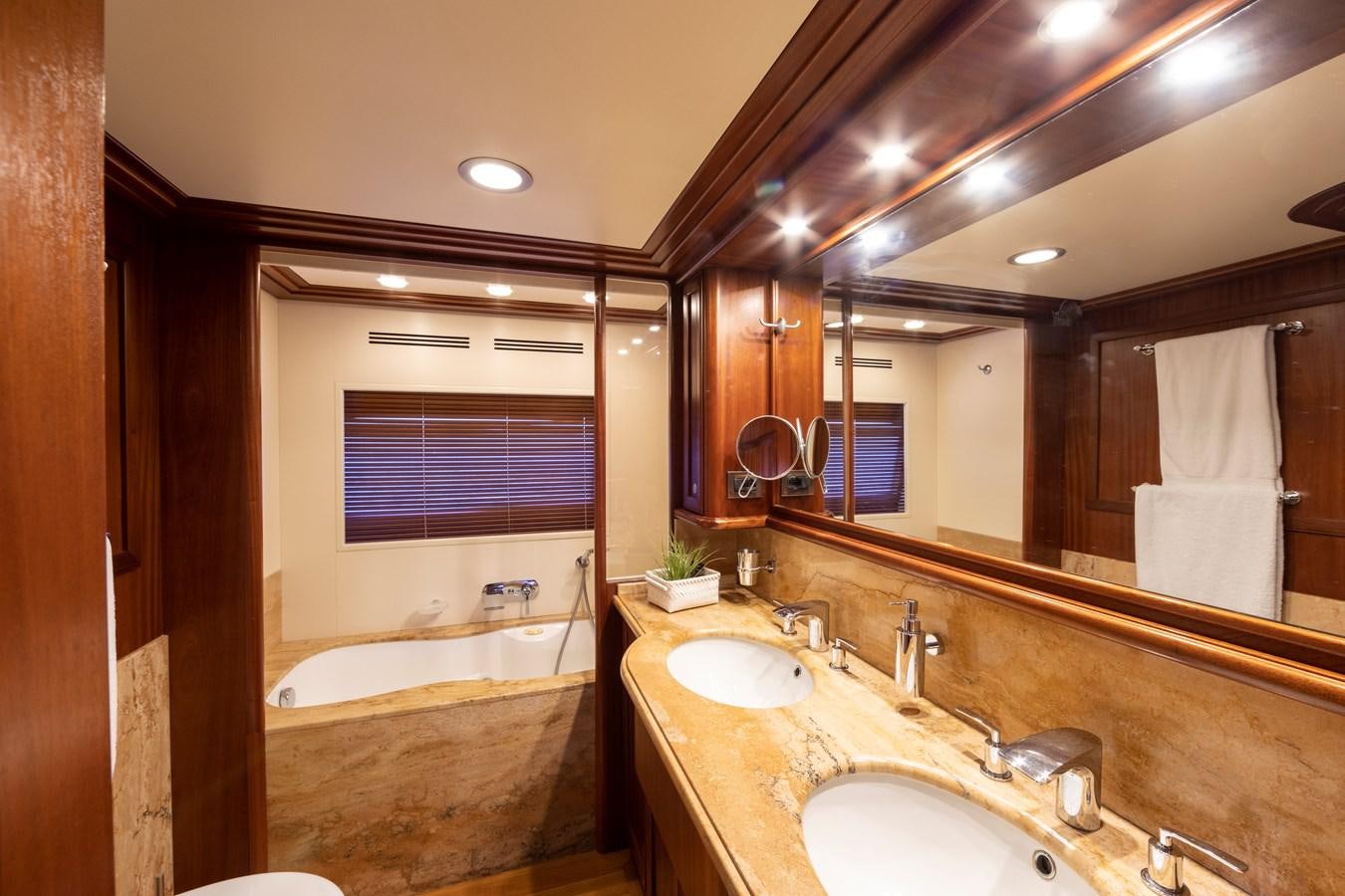 a bathroom with a large mirror aboard BIM Yacht for Sale