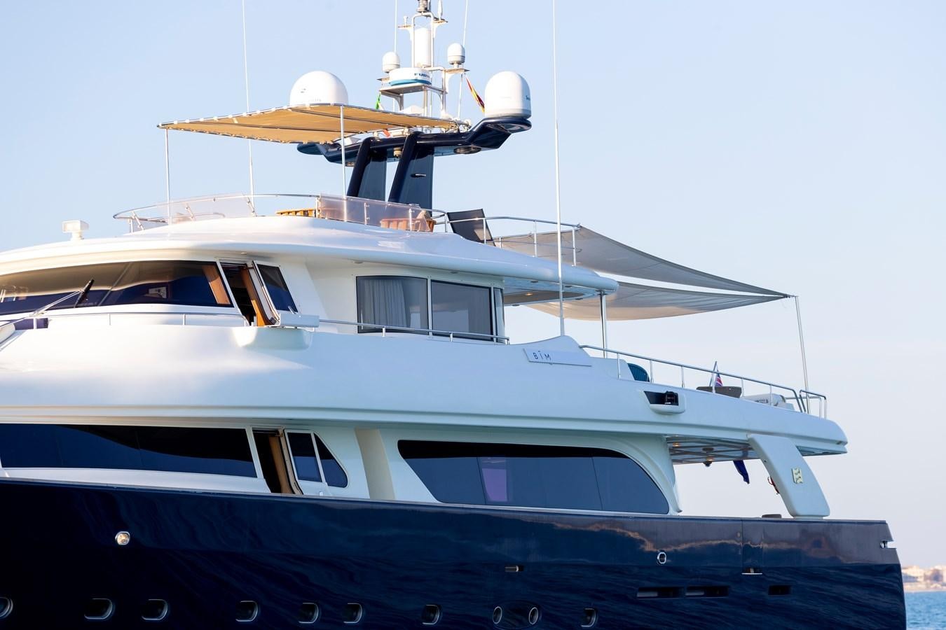 a boat with a satellite dish on top aboard BIM Yacht for Sale
