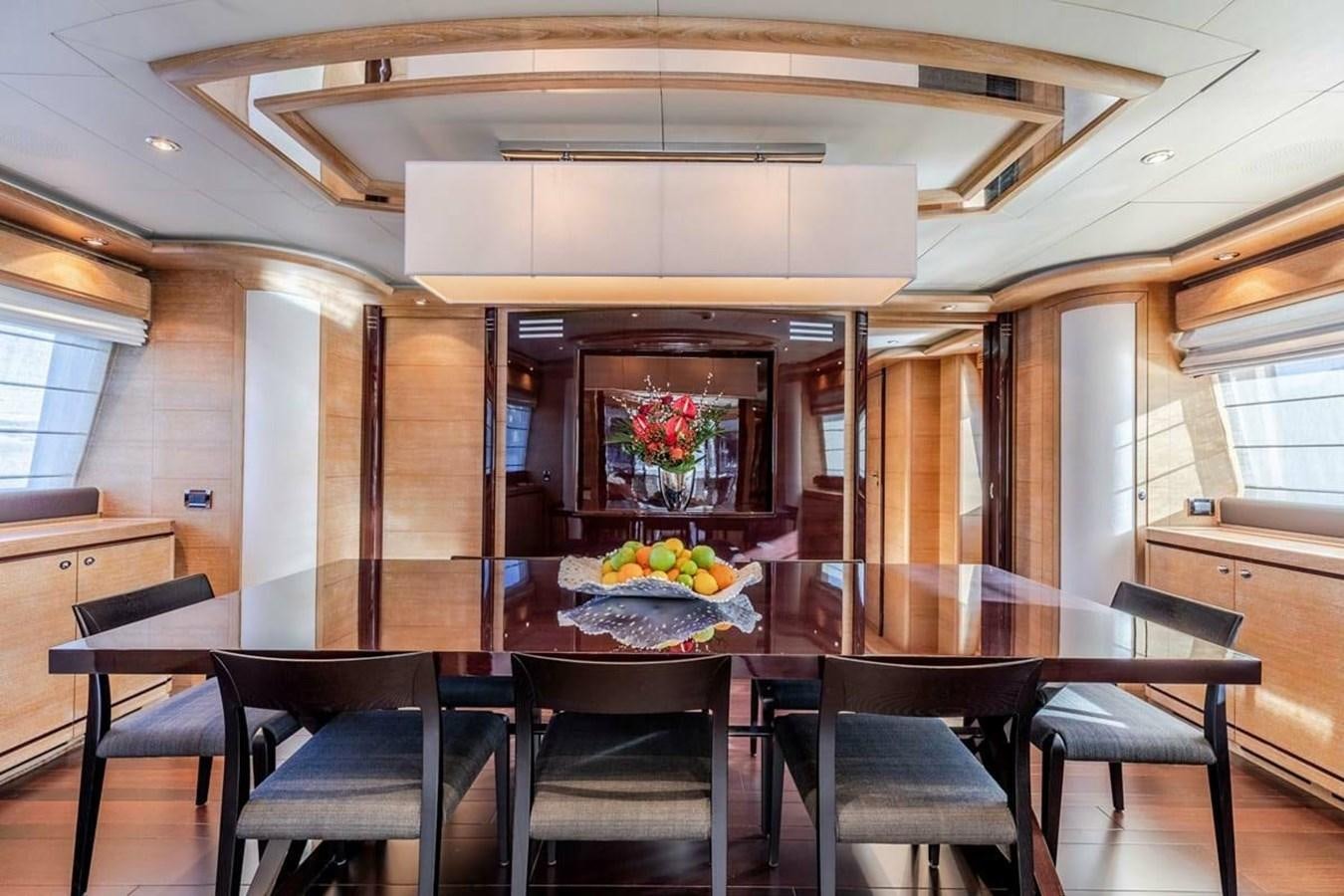 a kitchen with a table and chairs aboard AERO Yacht for Sale