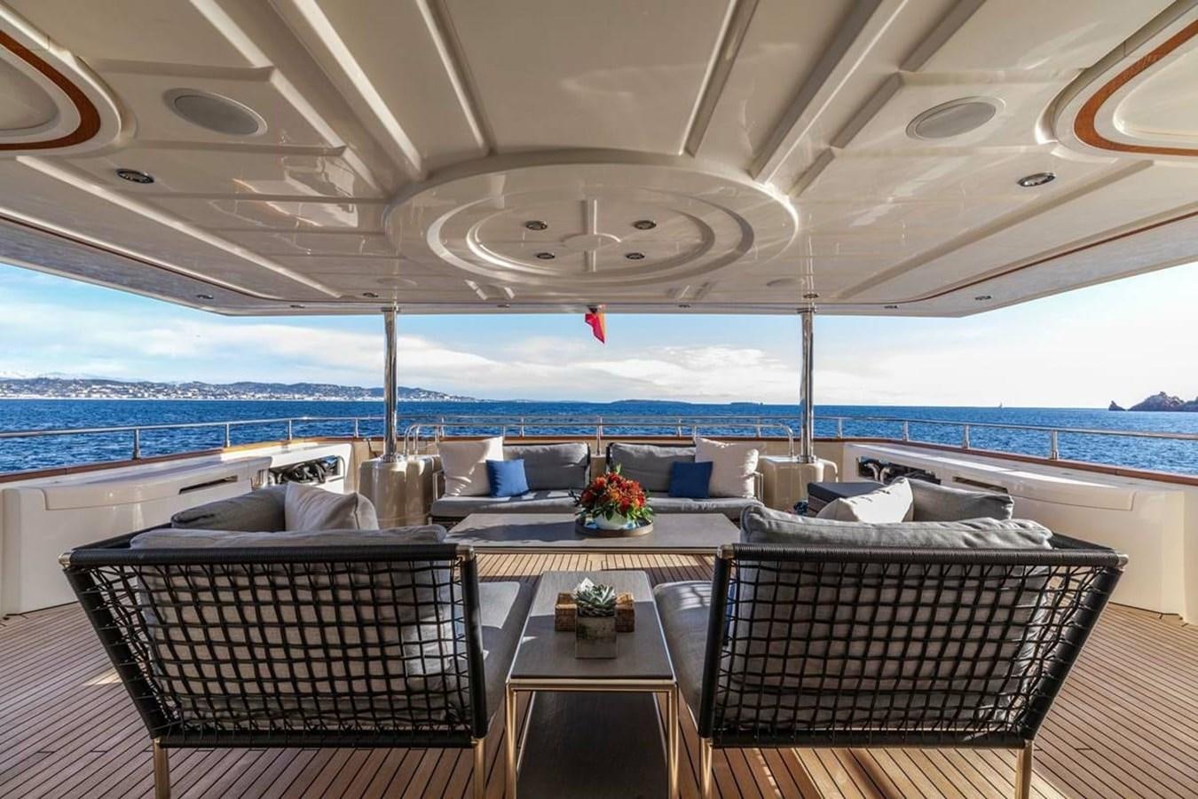 a room with a table and chairs aboard AERO Yacht for Sale