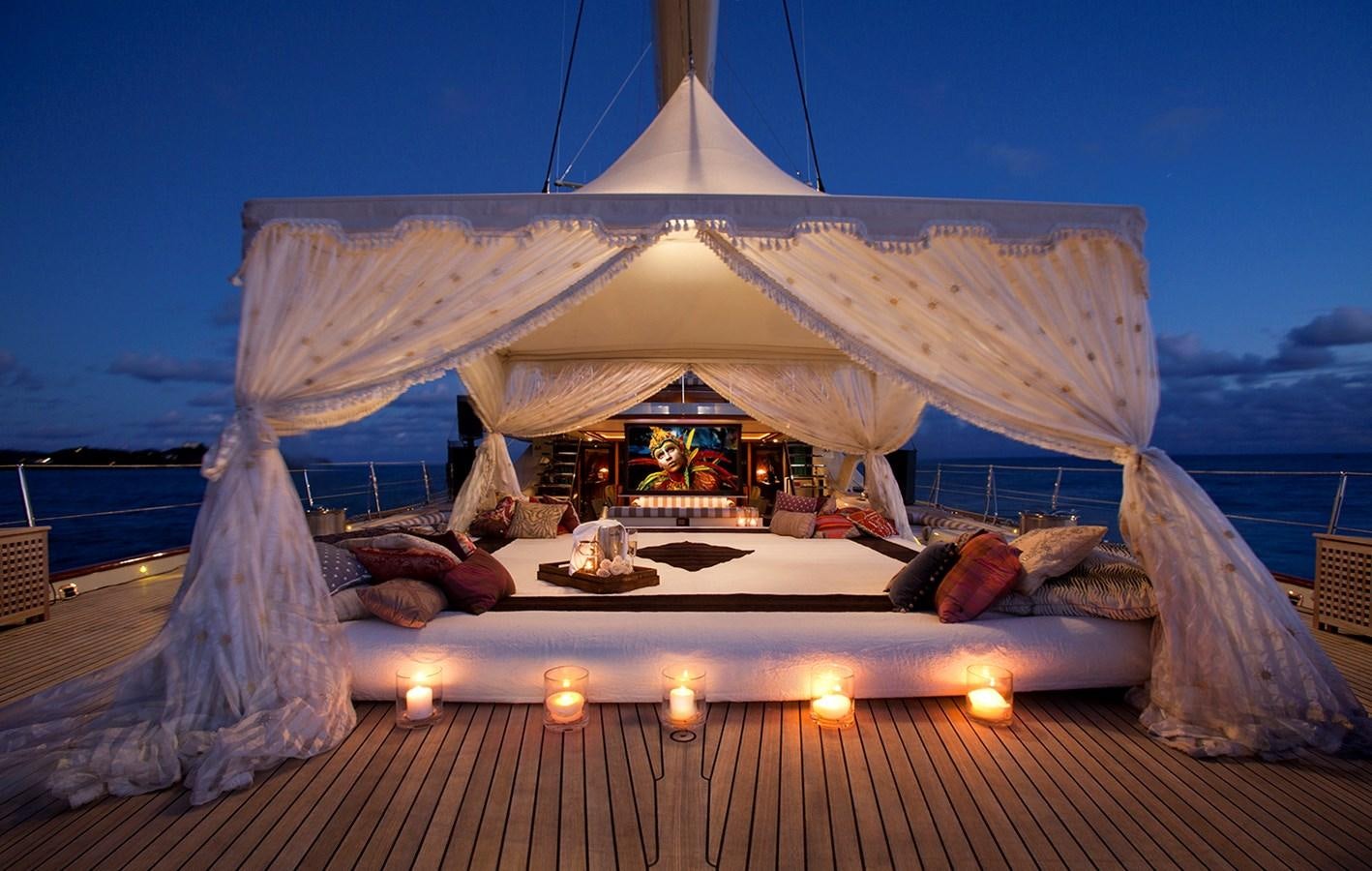 a tent with a person lying on it aboard TIARA II Yacht for Sale