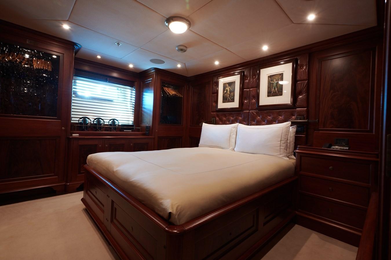 a bed in a room aboard TIARA II Yacht for Sale