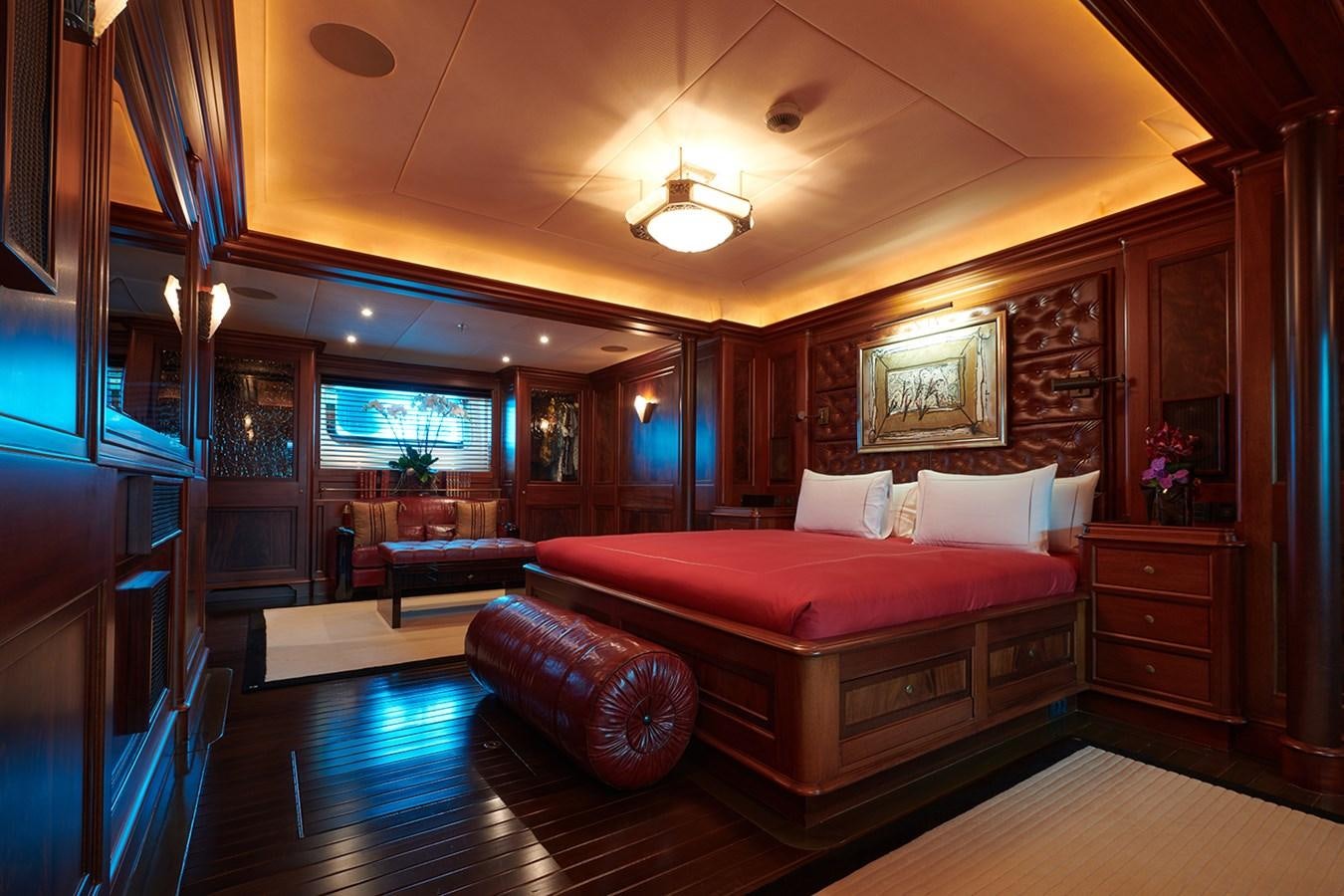 a large bedroom with a bed aboard TIARA II Yacht for Sale