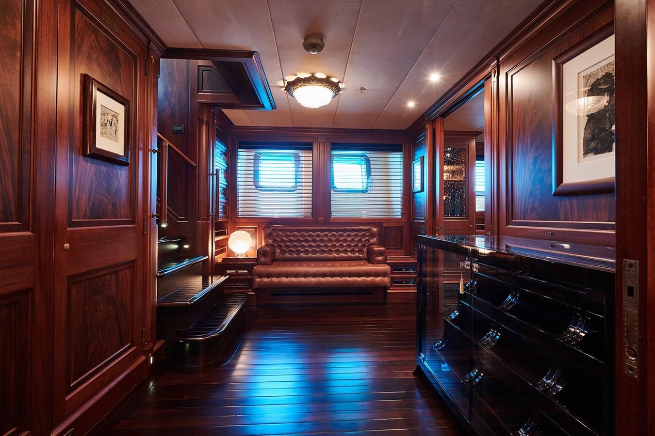 a room with wood cabinets and a wood floor aboard TIARA II Yacht for Sale
