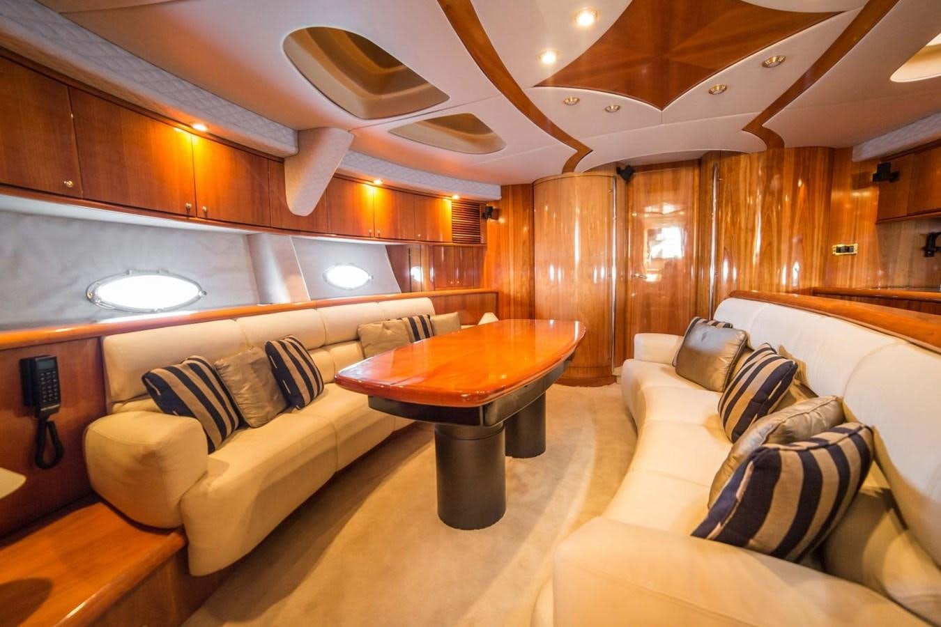 a living room with a couch and a table aboard LE CHIFFRE Yacht for Sale