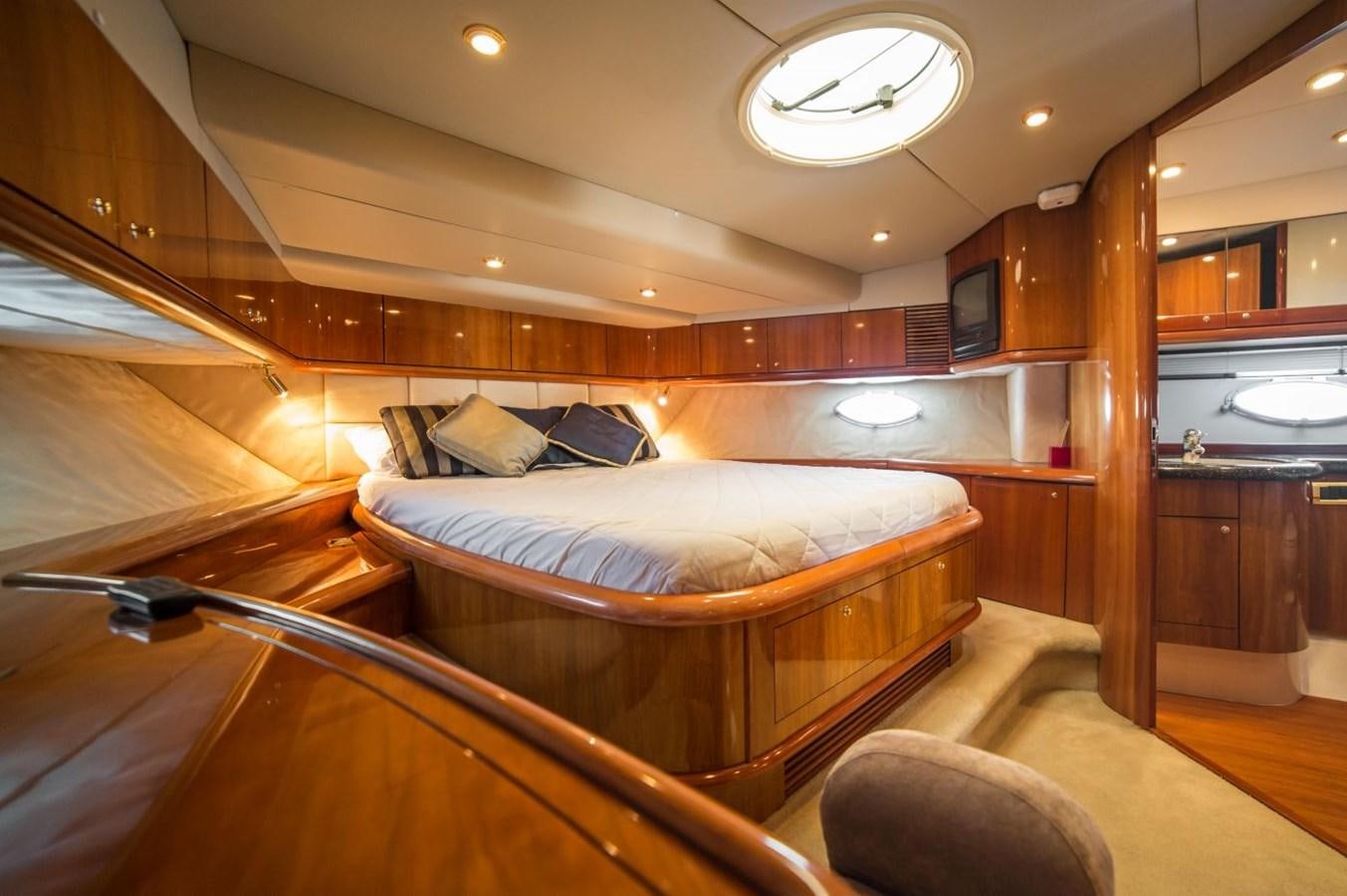 a bed in a cabin aboard LE CHIFFRE Yacht for Sale