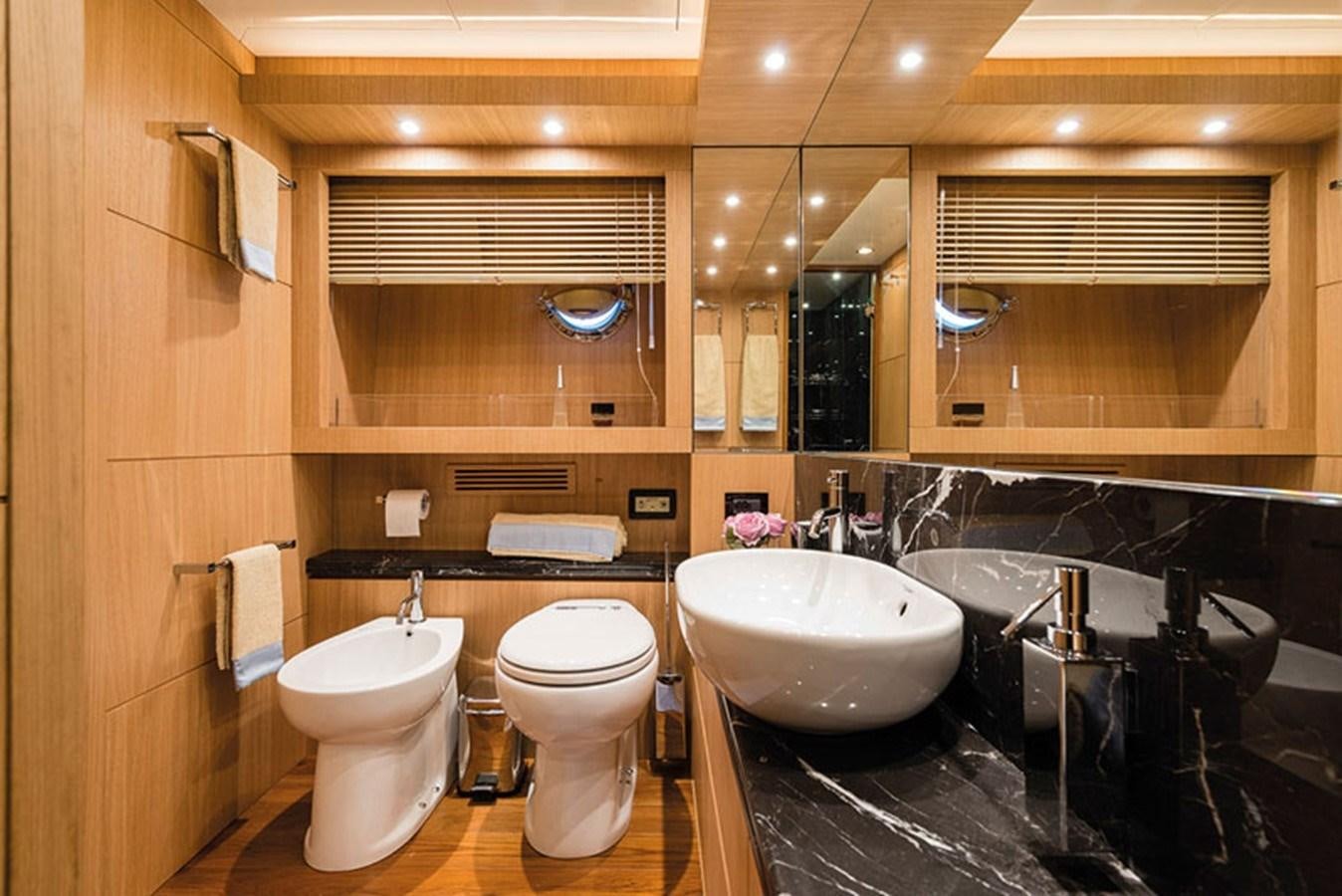 a bathroom with a large mirror aboard UNICA Yacht for Sale