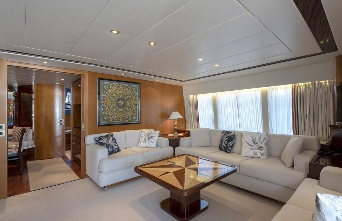 a living room with a couch and a table aboard CODECASA DUE FALCO 24 Yacht for Sale