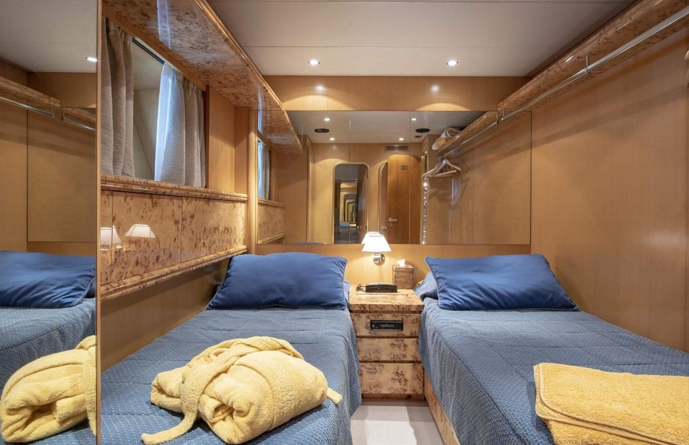 a room with a bed and a dresser aboard CODECASA DUE FALCO 24 Yacht for Sale