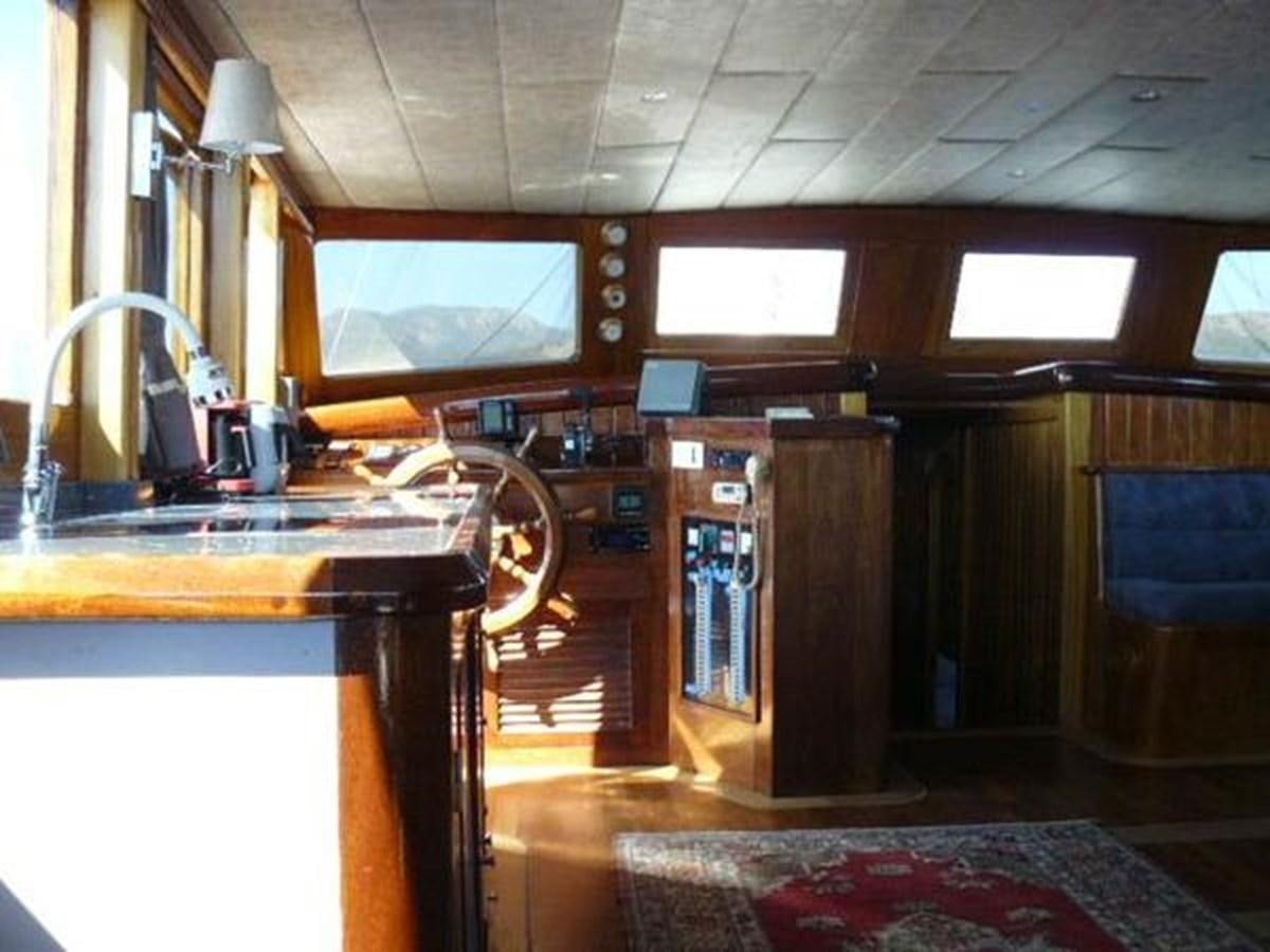 a kitchen with a sink and a stove aboard 1998 CUSTOM SAILING YACHT Yacht for Sale