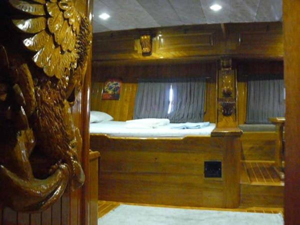 a bed sits in a room aboard 1998 CUSTOM SAILING YACHT Yacht for Sale