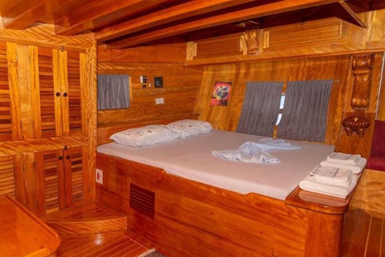 a bed in a room aboard 1998 CUSTOM SAILING YACHT Yacht for Sale
