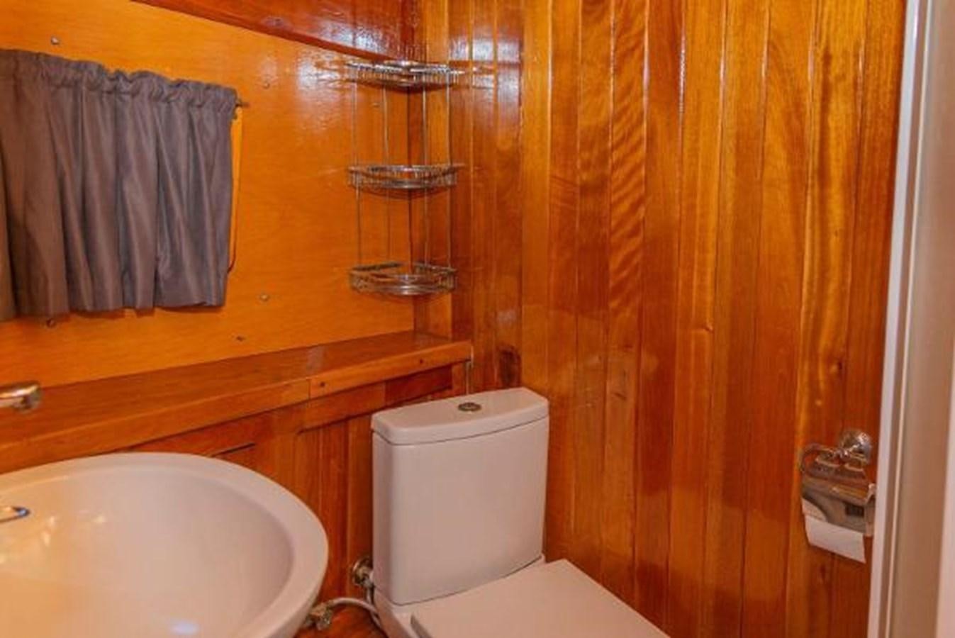 a bathroom with a toilet and sink aboard 1998 CUSTOM SAILING YACHT Yacht for Sale