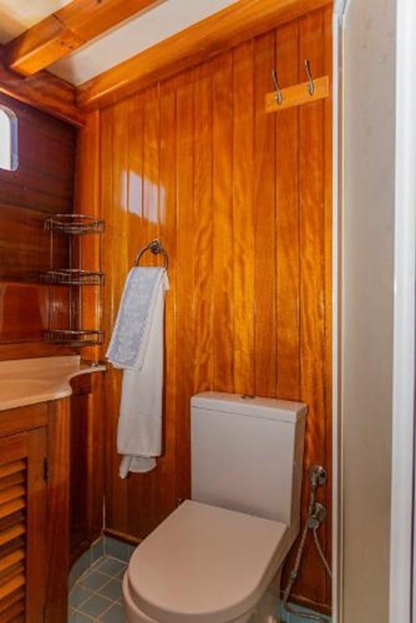 a bathroom with a toilet and sink aboard 1998 CUSTOM SAILING YACHT Yacht for Sale