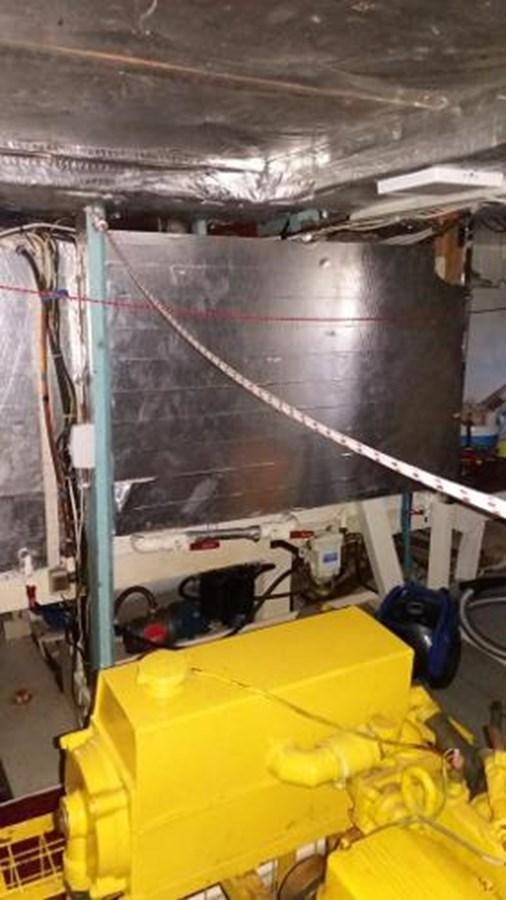 a large yellow machine aboard 1998 CUSTOM SAILING YACHT Yacht for Sale