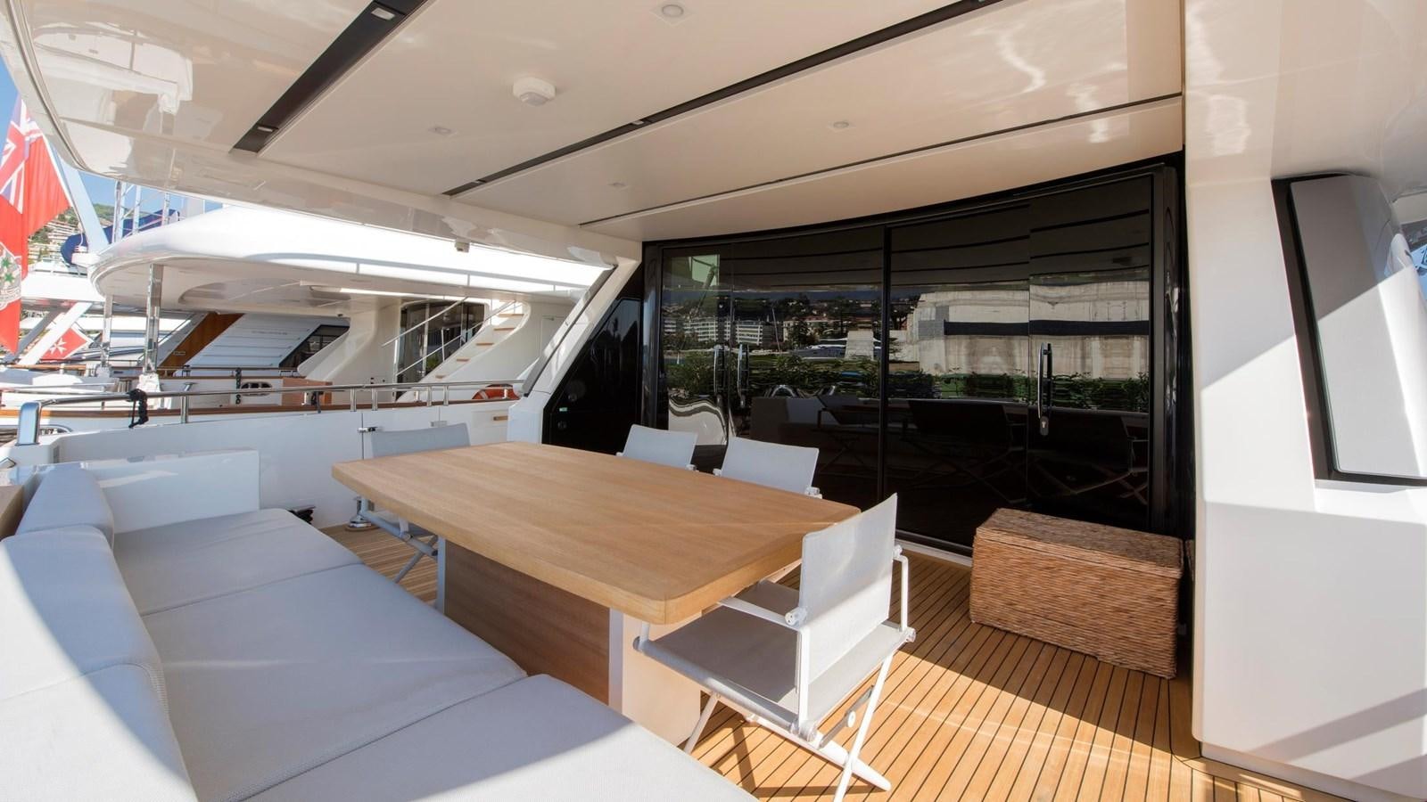 a room with a table and chairs aboard 2015 SANLORENZO SL96 #623 Yacht for Sale