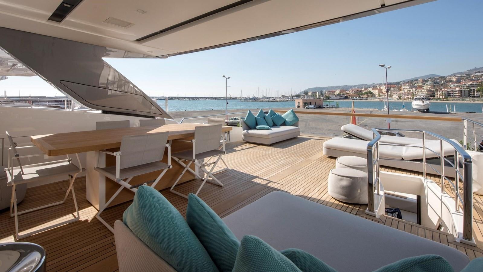 a deck with a view of the ocean and a city aboard 2015 SANLORENZO SL96 #623 Yacht for Sale