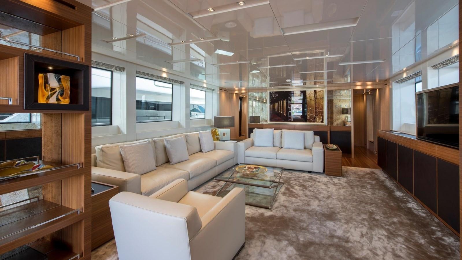 a living room with a large screen aboard 2015 SANLORENZO SL96 #623 Yacht for Sale