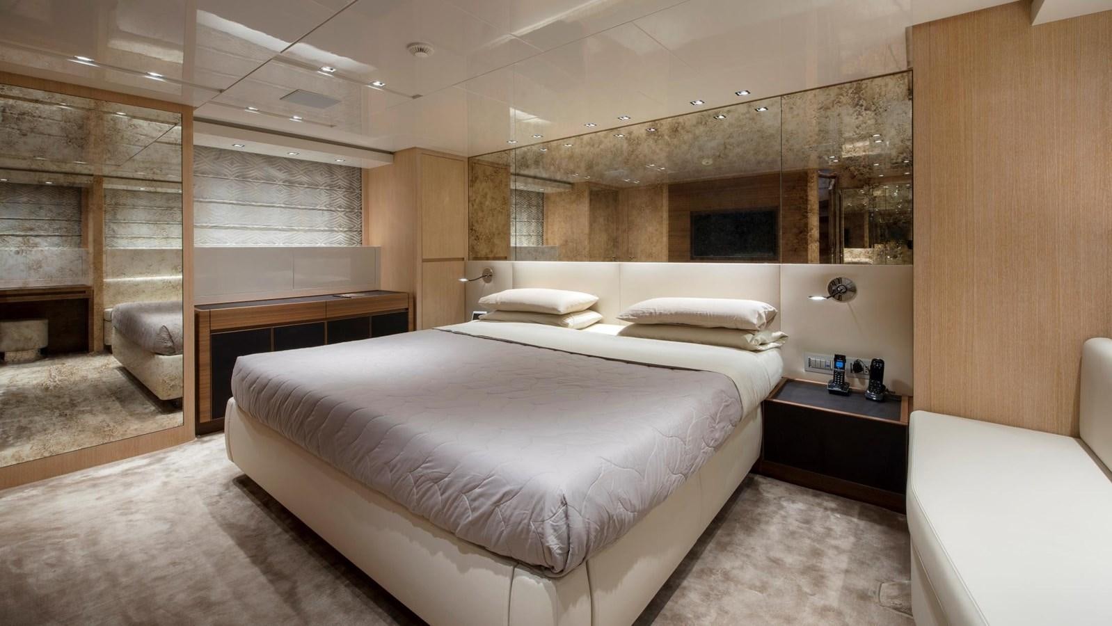 a room with a bed and a fireplace aboard 2015 SANLORENZO SL96 #623 Yacht for Sale