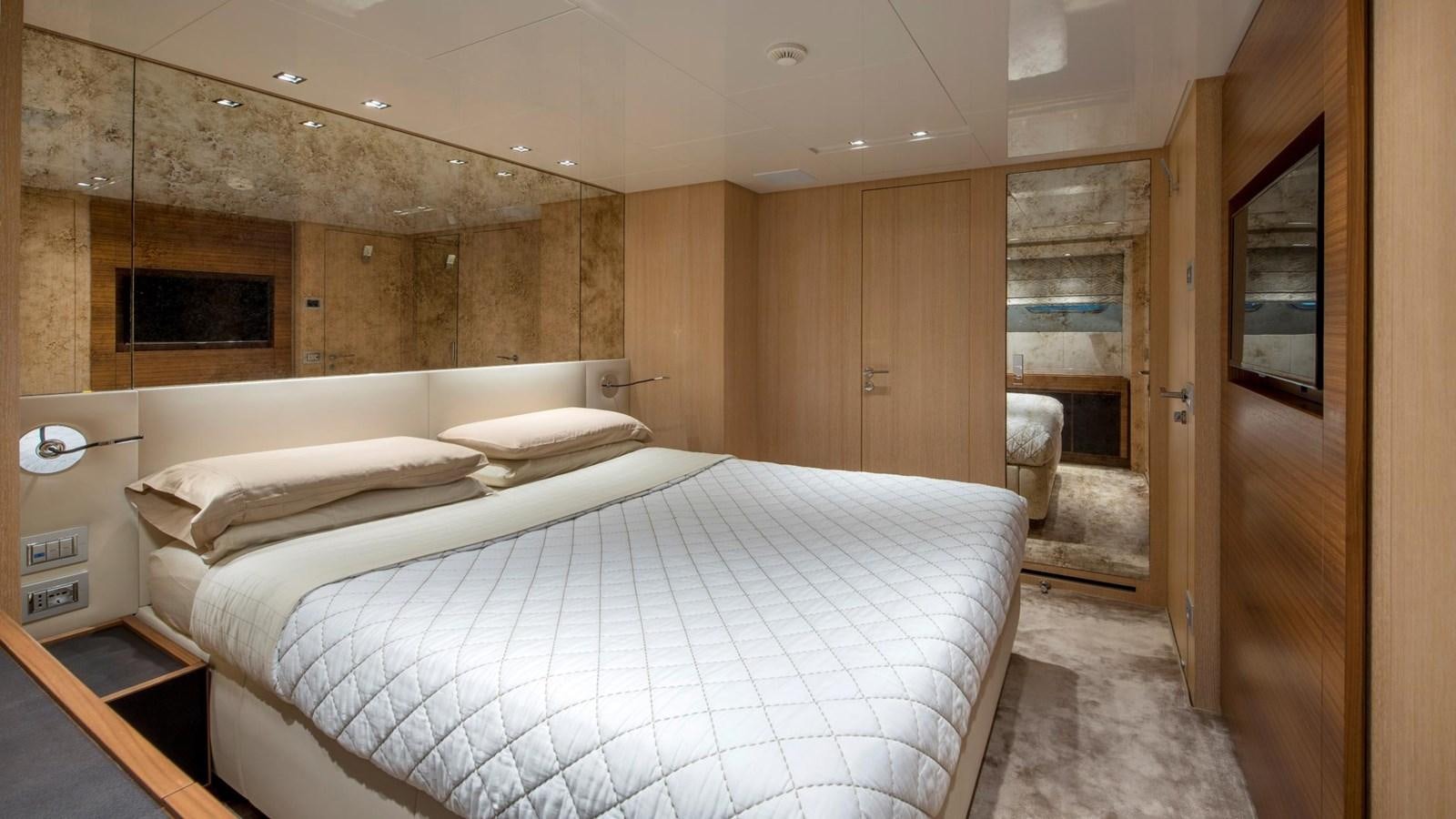 a room with a bed and a mirror aboard 2015 SANLORENZO SL96 #623 Yacht for Sale