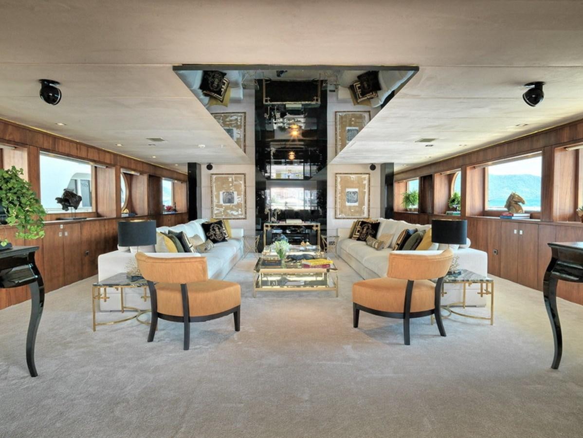 a living room with a fireplace aboard QUEEN MARE Yacht for Charter