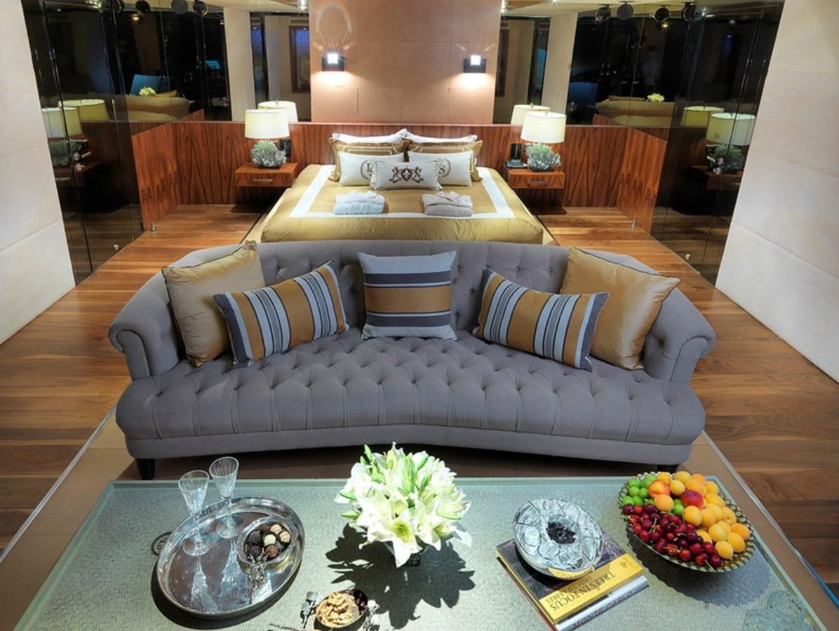 a living room with a couch and a table aboard QUEEN MARE Yacht for Charter