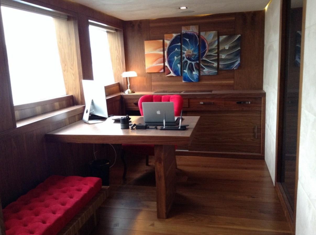 a room with a laptop and a desk aboard QUEEN MARE Yacht for Charter