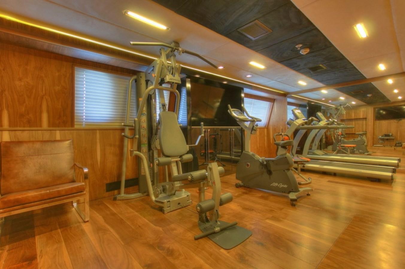 a gym with exercise equipment aboard QUEEN MARE Yacht for Charter