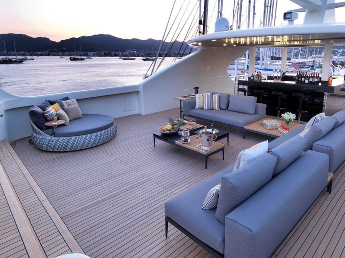 a patio with couches and a table on it aboard QUEEN MARE Yacht for Charter