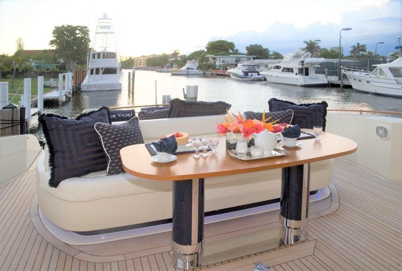a table with a flower arrangement on it aboard BON VIVANT Yacht for Sale