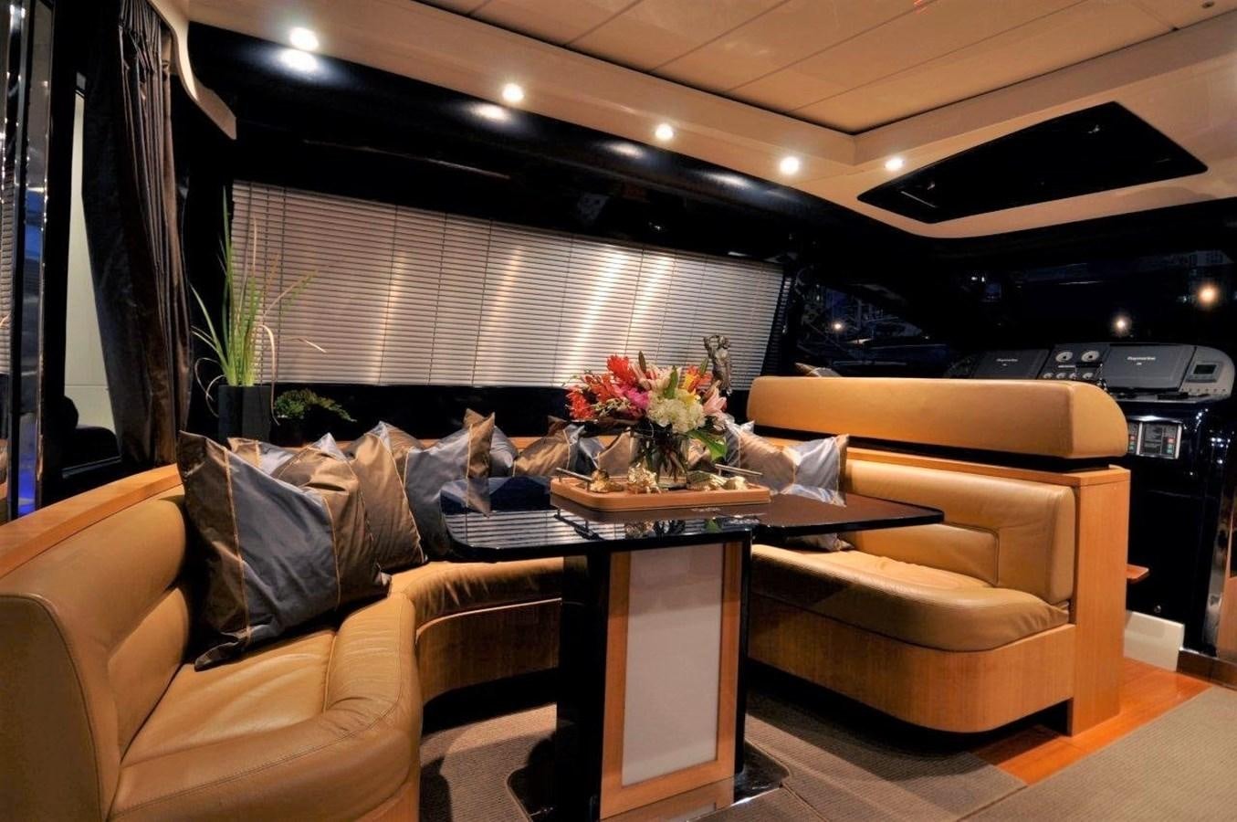 a living room with a couch and a table aboard BON VIVANT Yacht for Sale