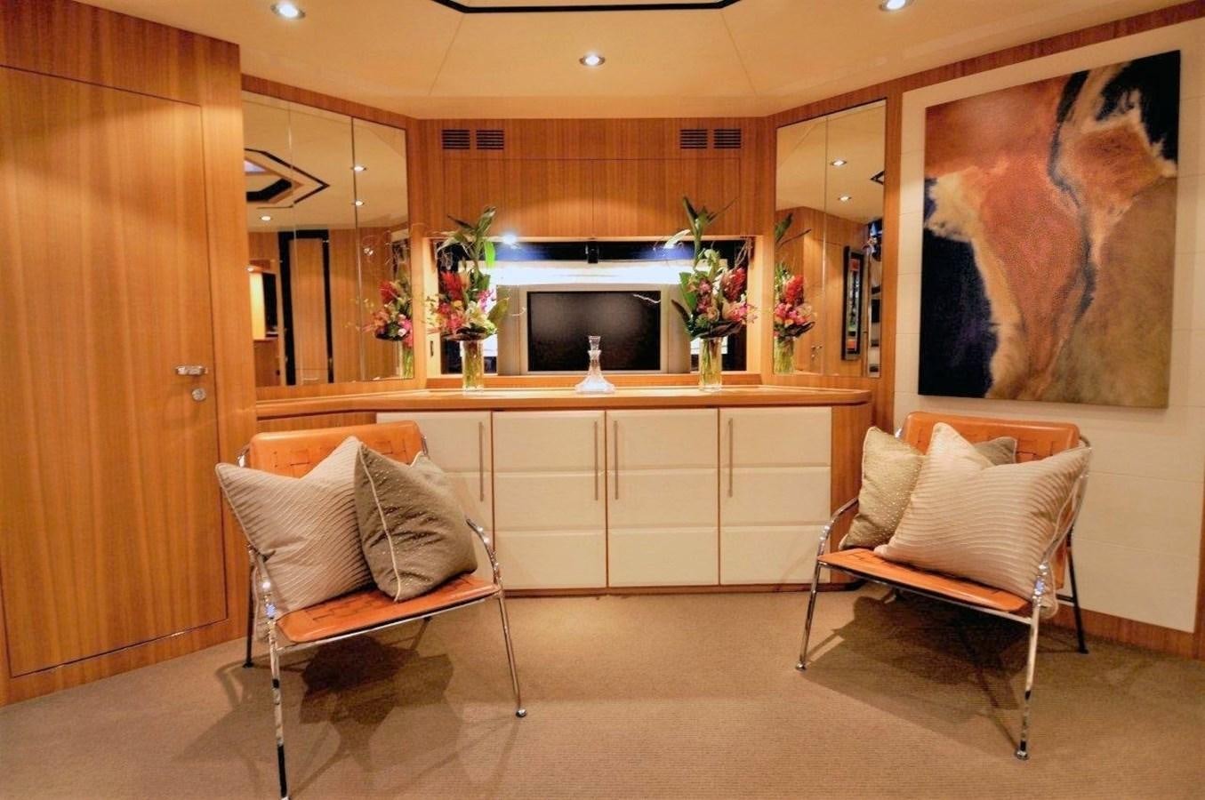 a room with a couch and a chair aboard BON VIVANT Yacht for Sale