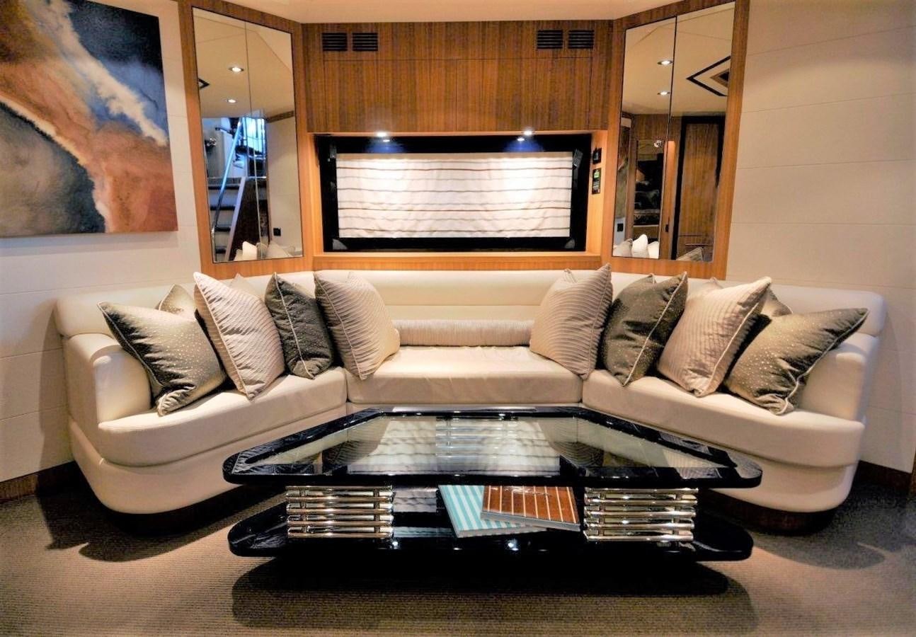 a living room with a large coffee table aboard BON VIVANT Yacht for Sale